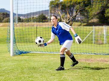 Foto von Fußballspielerin im Tor